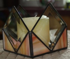 yellow candle holder with beveled sides